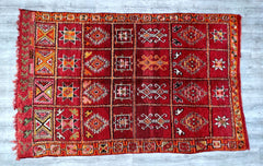 Discover the allure of this antique Moroccan tribal rug, a masterpiece of Berber craftsmanship. Woven by hand using traditional techniques, this rug features bold geometric designs and a rich, faded color palette that tells a story of generations past. The premium wool construction ensures both softness and resilience, making it suitable for high-traffic areas. Its versatile aesthetic complements a variety of decor styles, from mid-century modern to global eclectic. Whether layered over hardwood floors or d