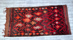 Bring timeless sophistication to your home with this antique Turkmen carpet, a masterpiece of hand-knotted wool and intricate tribal designs. Featuring rich reds, deep blues, and earthy neutrals, this vintage rug exudes old-world charm and craftsmanship. Ideal for adding warmth to dining rooms, lounges, or entryways, its durable construction ensures years of beauty. The detailed geometric patterns reflect Central Asian nomadic traditions, making it a unique statement piece for collectors and design enthusia