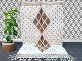 Discover the finest Beni Ouarain Berber rugs at woolberber.com—your trusted source for authentic Moroccan handwoven carpets. Each rug is crafted by skilled artisans using 100% natural wool, featuring the iconic geometric patterns and plush texture of traditional Beni Ouarain tribes. Perfect for modern and bohemian interiors, our rugs add warmth, texture, and cultural elegance to any space. Available in vintage and custom designs, these ethically sourced rugs support fair trade practices. Shop now for exclus