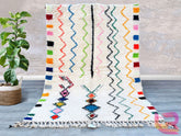 Elevate your home with this handmade Beni Ourain-style rug, inspired by the iconic tribal designs of Morocco. Woven from premium natural wool, this vintage Berber rug features a plush texture and minimalist geometric motifs, perfect for adding warmth to any room. The neutral tones complement both contemporary and traditional interiors, making it a versatile choice for living rooms, dining areas, or bedrooms. Each rug is one-of-a-kind, showcasing the artisan’s craftsmanship and cultural heritage. Durable, co