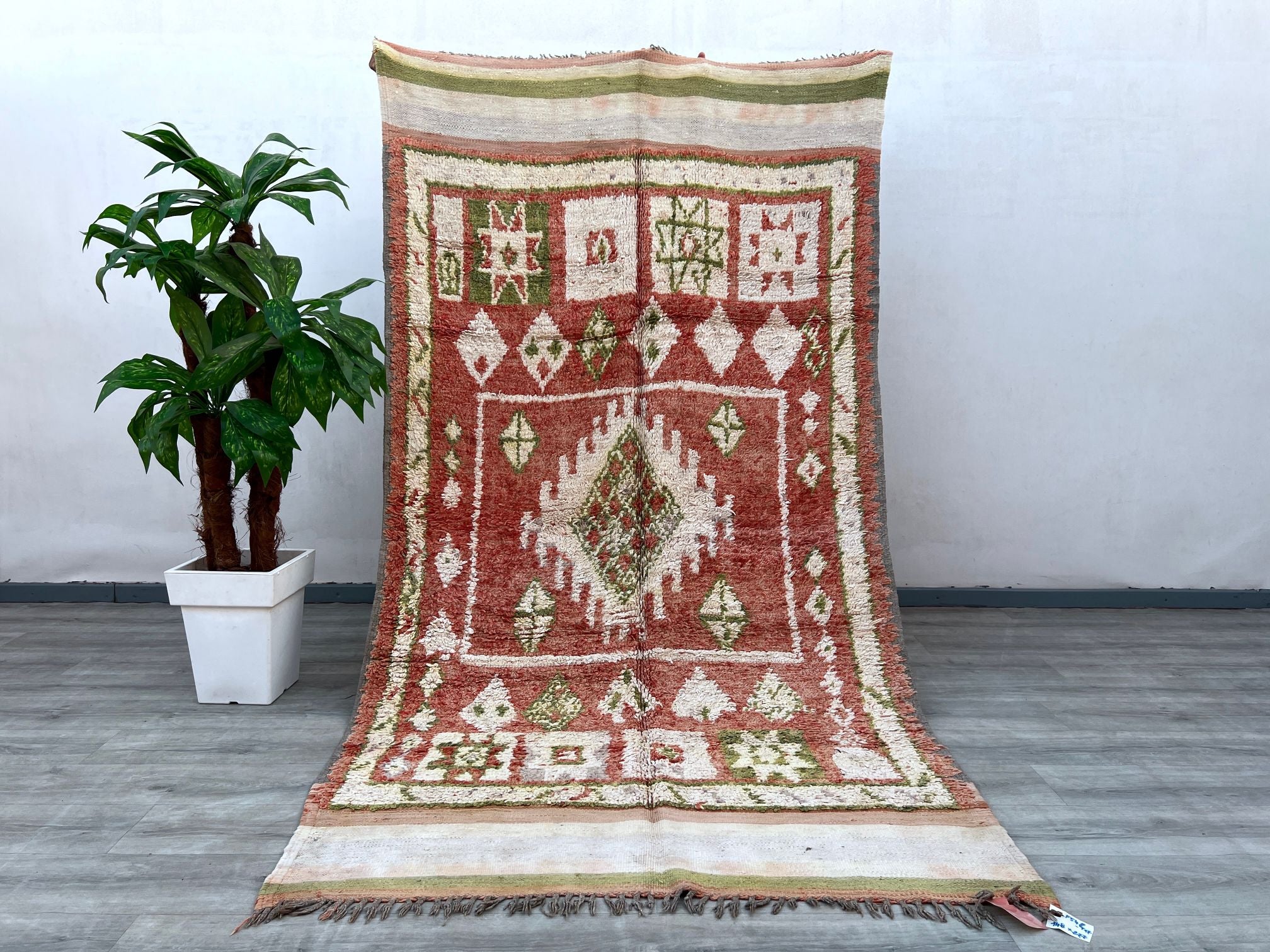 Elevate your space with an authentic Beni Ourain vintage carpet, known for its minimalist yet striking tribal patterns. Made from natural wool, this handwoven Moroccan rug offers a plush, cozy feel underfoot while enhancing your home’s aesthetic. The neutral tones and geometric designs blend seamlessly with boho, Scandinavian, or contemporary interiors. Whether used as a statement piece in the living room or a luxurious bedroom accent, this vintage Berber rug adds texture, history, and elegance to any decor