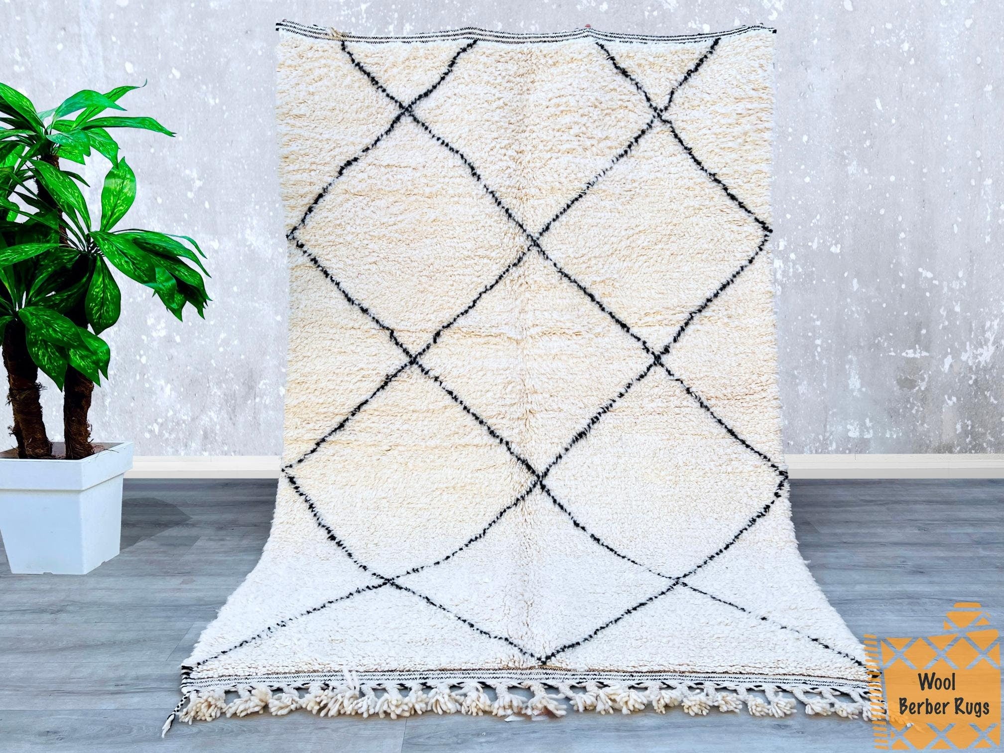 Bring the rich heritage of Morocco into your home with this authentic Berber carpet, meticulously handwoven using traditional techniques. Made from premium natural wool, this plain Moroccan rug offers a plush, cozy feel underfoot, making it perfect for high-traffic areas. The versatile white design complements any interior style—Scandinavian, rustic, or eclectic. Whether used as a statement piece or a subtle accent, this handmade wool rug adds texture and sophistication. Free from synthetic dyes, it’s an ec