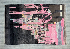 Elevate your space with an authentic Boujad Berber rug, hand-knotted by Moroccan artisans using traditional methods. These vintage-inspired rugs showcase bold geometric patterns in rich shades of pink, gray, and black, creating a striking focal point in any room. Made from natural wool, each rug is soft underfoot while being durable enough for high-traffic areas. Ideal for boho-chic, mid-century, or global-inspired interiors, a Boujad rug blends artistry with functionality. Whether you choose a distressed v