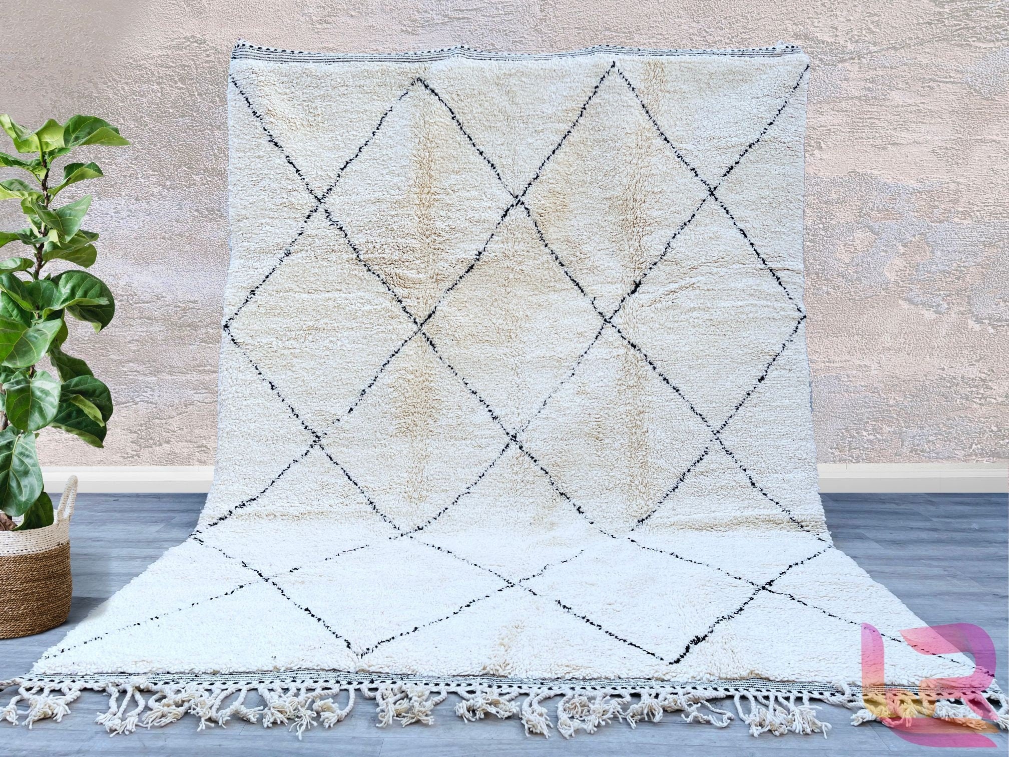 Elevate your home with this exquisite handmade Moroccan Beni Ourain rug, crafted from 100% natural wool for unmatched softness and durability. Featuring a timeless black-and-white geometric design, this Berber carpet adds a touch of boho-chic elegance to any space. Perfect for living rooms, bedrooms, or cozy reading nooks, this plush area rug brings warmth and texture to modern, minimalist, or eclectic interiors. Each piece is meticulously handwoven by skilled artisans, ensuring a unique and high-quality fi