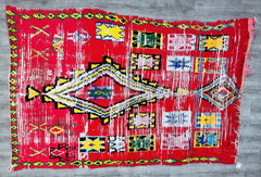 Bring the essence of Morocco into your home with this authentic handmade vintage rug. Woven by Berber artisans using age-old techniques, this piece showcases a striking tribal design with rich red hues and intricate patterns. The natural wool fibers provide a soft, durable surface, perfect for cozy living rooms, bedrooms, or entryways. Its distressed vintage finish adds rustic elegance, making it a versatile choice for bohemian, farmhouse, or global-inspired decor. Each rug tells a story through its unique