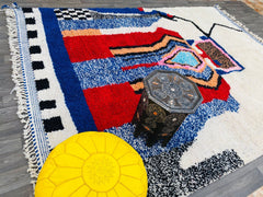 Discover the beauty of authentic Moroccan rugs, including Beni Ourain, Azilal, and Boujad carpets, handwoven by Berber artisans. Each piece is crafted from 100% natural wool, featuring tribal patterns, vibrant colors, and unique abstract designs. Whether you're looking for a luxurious living room centerpiece, a cozy bedroom rug, or a boho-chic decor accent, our collection offers custom sizes (5x8, 9x12, and more) to fit any space. From vintage Azilal rugs with geometric motifs to soft white Beni Ourain carp