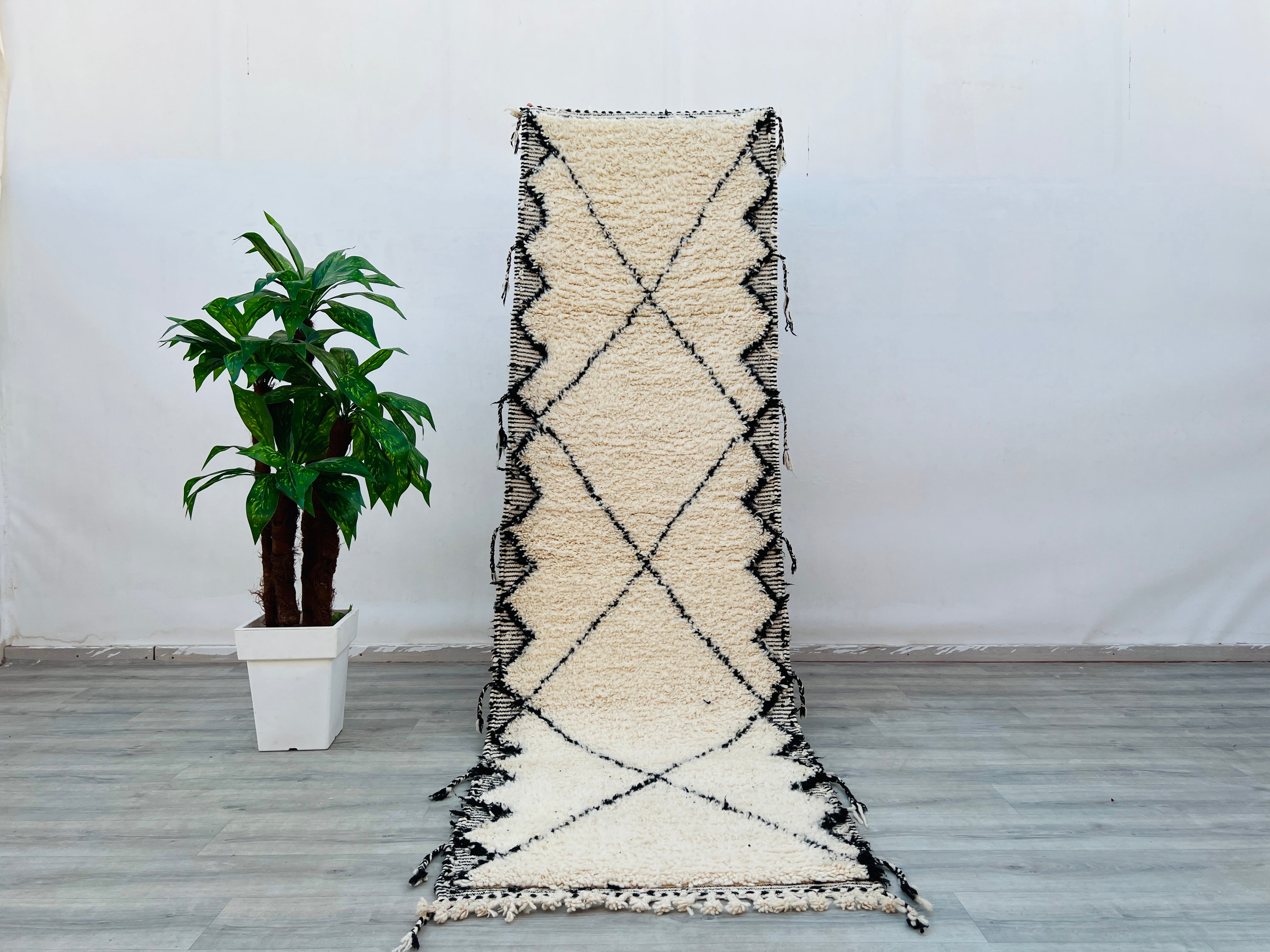 Discover the beauty of authentic Moroccan rugs, from Beni Ourain’s geometric patterns to vibrant Azilal tribal designs. Handwoven by Berber women using 100% natural wool, these rugs feature intricate motifs, soft textures, and earthy tones, making them ideal for boho, hygge, or art deco interiors. Available in various sizes, including 3x8 ft, 5x8 ft, and custom dimensions, each piece tells a cultural story. Whether you seek a shaggy vintage rug or a minimalist black-and-white carpet, these fair-trade, ethic