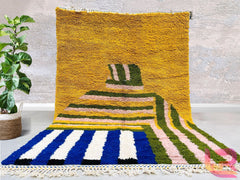 Enhance your home with this bohemian Beni Ourain rug, a hand-knotted masterpiece crafted from premium wool. Featuring intricate geometric patterns, this Moroccan tribal rug blends traditional craftsmanship with modern boho style. The plush, high-quality wool provides a luxurious feel underfoot, while the neutral tones effortlessly complement any decor. Perfect for layering or as a statement piece, this handmade Berber carpet adds texture and warmth to living spaces, bedrooms, or meditation corners. Each rug