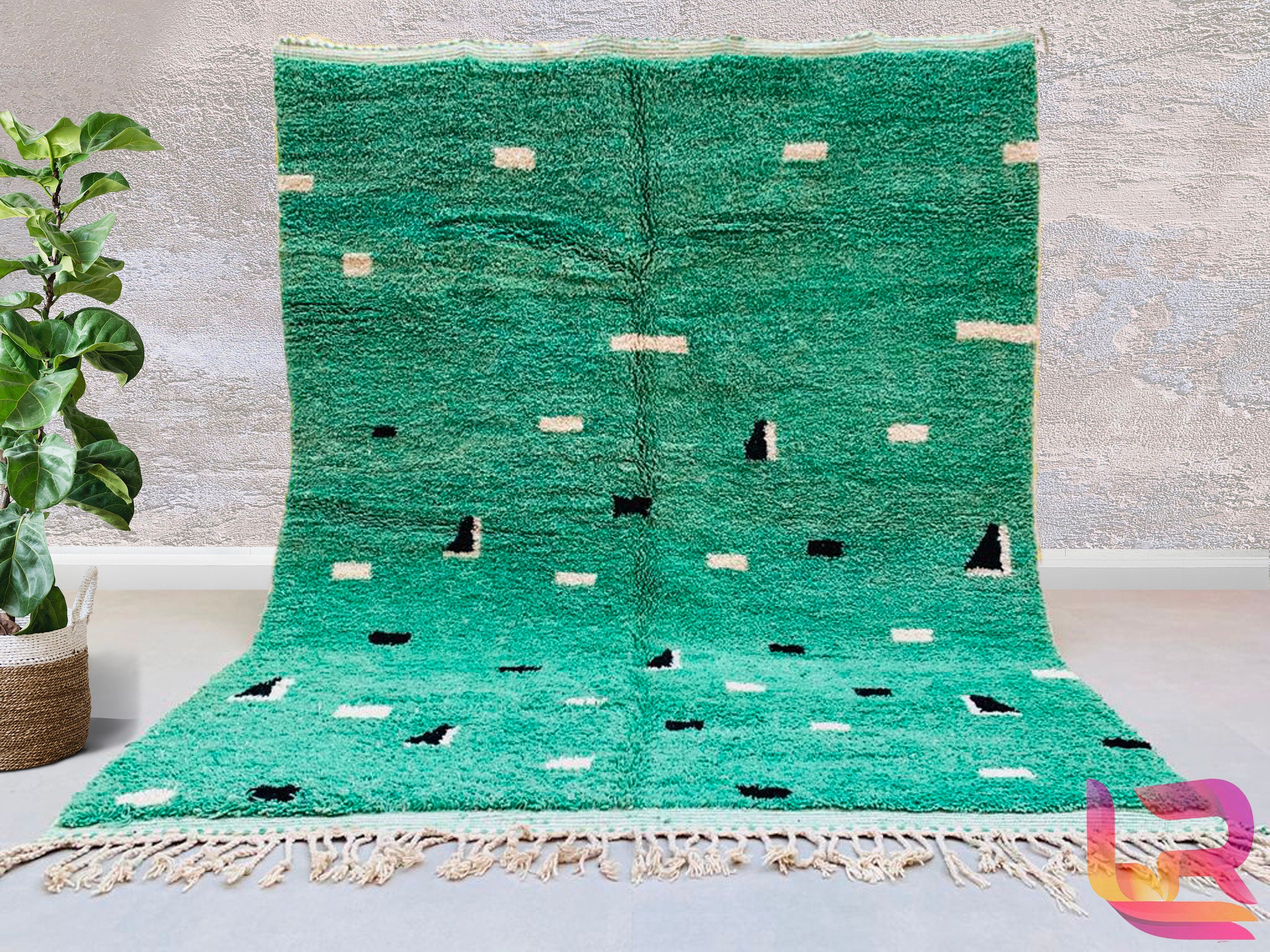 Bring a touch of global artistry into your home with this bohemian green Moroccan rug, a handmade Berber carpet woven with care by Moroccan artisans. Featuring rich emerald and olive tones, this wool rug is both luxurious and durable, ideal for high-traffic areas. The abstract patterns and organic imperfections tell a story of traditional craftsmanship, making each rug one-of-a-kind. Whether used as a statement floor piece or a cozy accent, this vintage-inspired rug complements mid-century, boho, or minimal