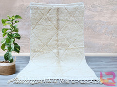 Elevate your home décor with a stunning Moroccan Berber rug, handwoven by artisans using traditional techniques. These rugs showcase intricate tribal patterns and a plush wool texture, offering both style and comfort. The neutral tones and geometric designs effortlessly complement boho, Scandinavian, or contemporary interiors. Each rug is sustainably crafted, ensuring a unique, eco-friendly addition to your space. Whether used as a statement piece in the living room or a cozy accent in the bedroom, these ru