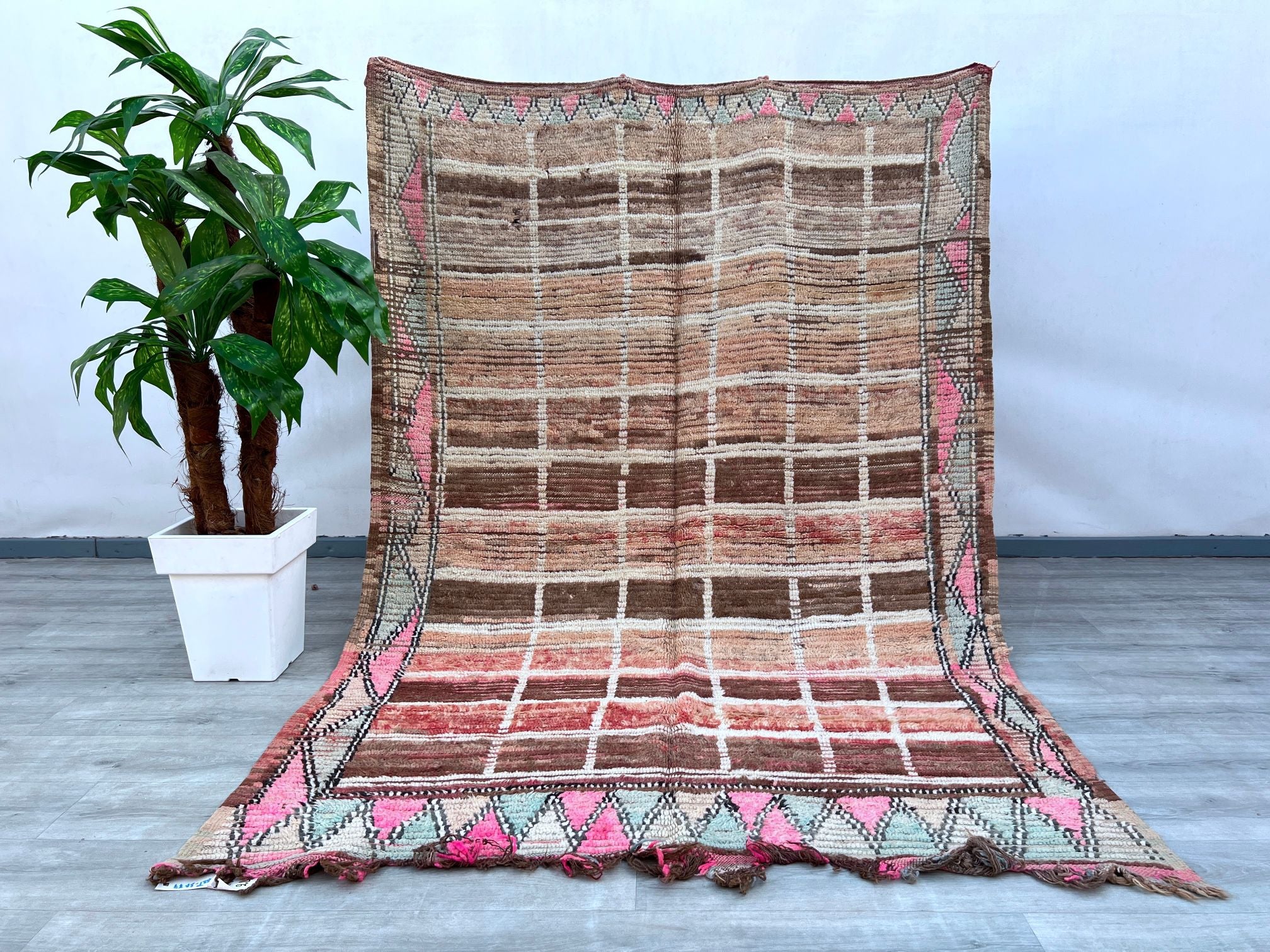 Elevate your décor with this stunning bohemian tribal rug, handwoven using traditional techniques. Made from premium wool, this Moroccan-inspired carpet features intricate geometric patterns and a plush pile, offering both comfort and durability. The vintage-inspired design adds a touch of global charm to any room, making it a perfect fit for boho, farmhouse, or eclectic interiors. Ethically sourced and fair trade, this rug supports artisan craftsmanship while bringing a piece of cultural heritage into your