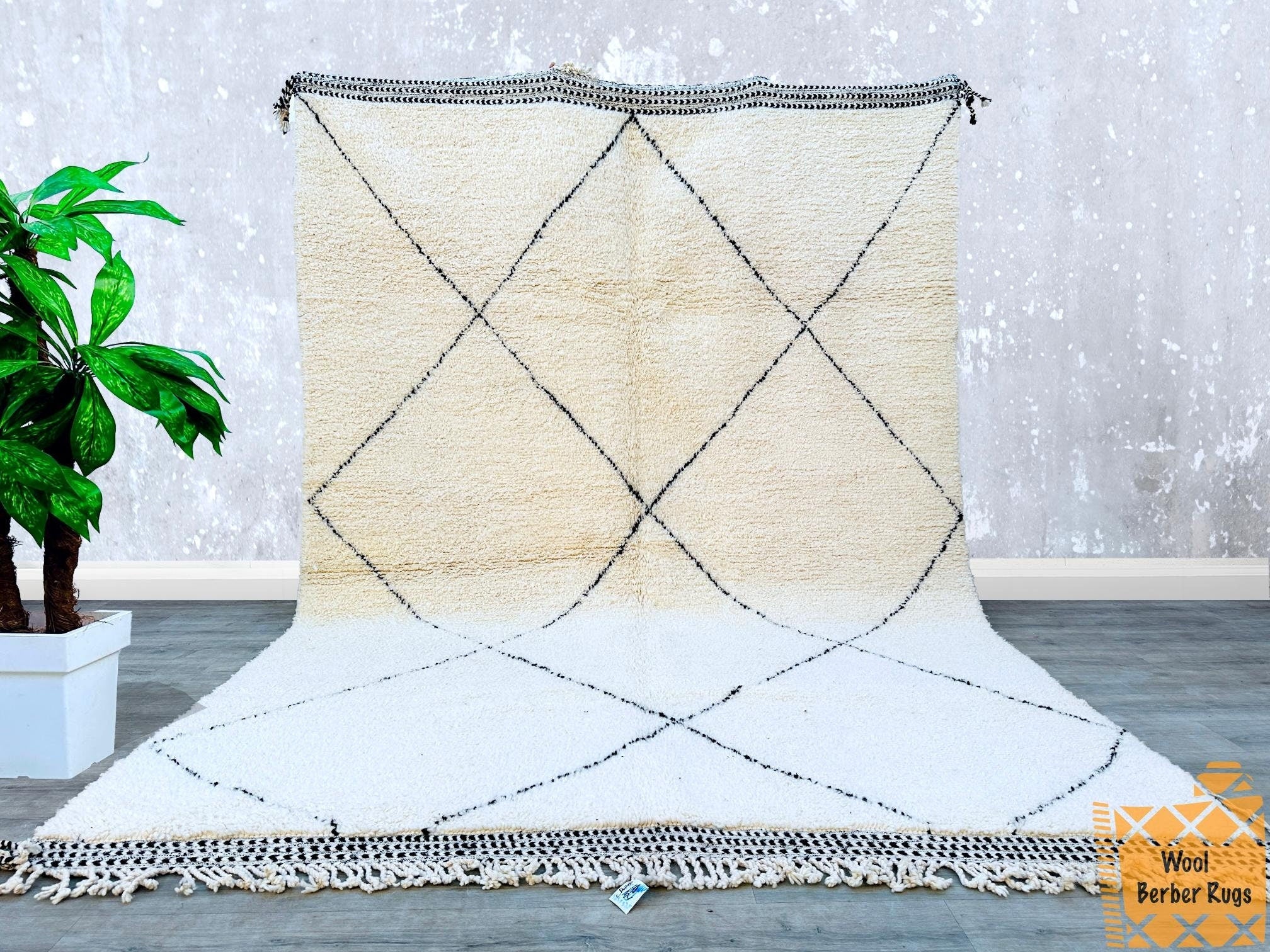 Enhance your home décor with stunning Moroccan rugs, handwoven using centuries-old Berber techniques. These 5x8 ft rugs showcase natural wool in beautiful black-and-white or colorful patterns, blending effortlessly with boho, Scandinavian, or minimalist styles. The Beni Ourain rugs feature plush textures and tribal motifs, while Azilal rugs offer playful abstract designs. Vintage Moroccan carpets bring a sense of history, with each rug bearing slight imperfections that highlight its handmade authenticity. W