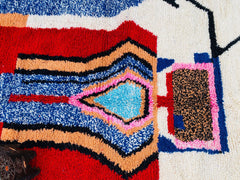Bring global flair to your space with handmade Moroccan rugs, featuring Azilal’s abstract art, Beni Ourain’s neutral tones, and Boujad’s vibrant patterns. These 100% wool rugs are handcrafted by Berber weavers, offering durable, plush, and eco-friendly floor decor. Ideal for boho, modern, or eclectic interiors, our rugs come in various sizes (5x8, 9x12, 300x200cm) and can be customized for a personal touch. Whether you need a statement piece for your living room, a cozy bedroom rug, or a unique wall hanging