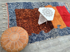Bring a burst of color and texture into your home with this handmade Moroccan Berber shag rug. Featuring a vibrant, abstract boho design, this plush wool rug is crafted with natural dyes and traditional weaving methods, ensuring a soft, durable finish. The shaggy, high-pile surface adds depth and coziness, making it perfect for living rooms, nurseries, or meditation spaces. The tribal-inspired motifs tell a story of heritage and craftsmanship, while the multicolored palette complements both neutral and bold