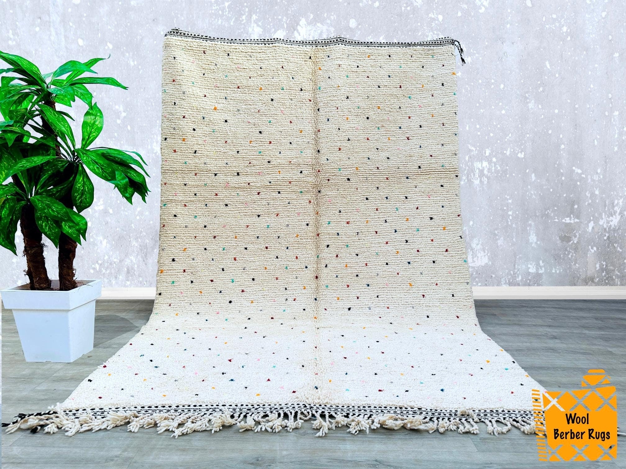 This large Moroccan Kilim Rug is an eye-catching addition to any room. Handwoven from durable wool, it features vibrant traditional patterns. Use it as a Rug, or Rug for extra seating or as a decorative accent in your space. Polka Dots Multi White .