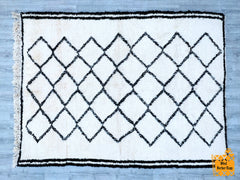 Indulge in luxury with this ultra-soft, shaggy Moroccan-inspired rug, designed for both comfort and style. Featuring a plush high-pile texture and a subtle diamond trellis pattern, this piece adds a touch of bohemian elegance to any space. The neutral ivory and charcoal tones effortlessly complement modern, coastal, or farmhouse interiors. Perfect for cozying up living rooms, bedrooms, or nurseries, this hand-loomed rug is both durable and easy to maintain. Its versatile design ensures it blends seamlessly