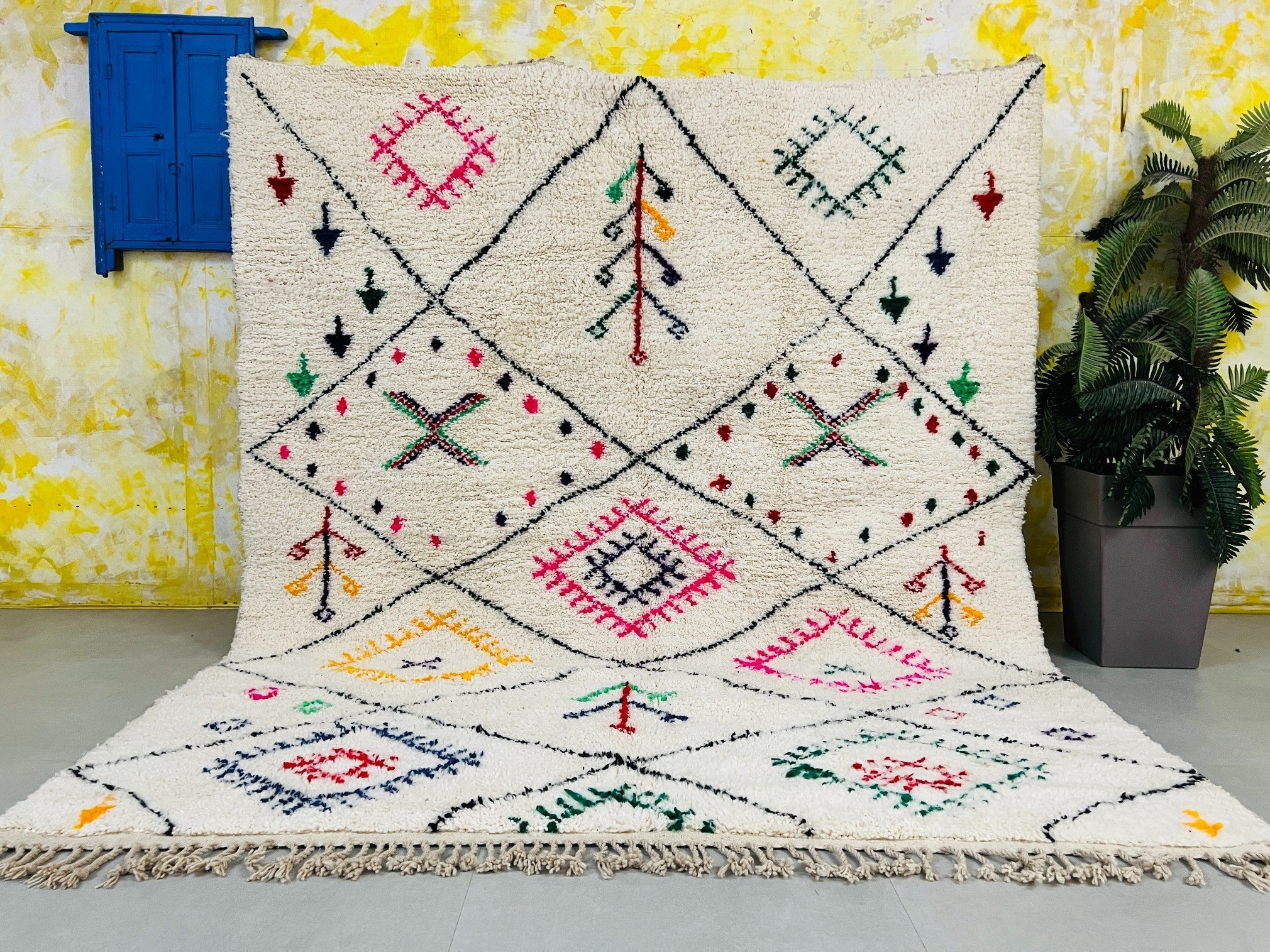 Discover the beauty of handmade Moroccan rugs with this Berber Beni Ourain carpet, available in any size or color. Made from natural wool, this soft, durable rug features intricate tribal patterns, perfect for bohemian, vintage, or modern interiors. Each piece is woven by artisans in Morocco, supporting fair-trade craftsmanship. Free shipping worldwide! Pair it with a Moroccan leather pouf for a complete ethnic look. Shop now for Azilal, Boujaad, and Kilim rugs—authentic Moroccan home decor at its finest.