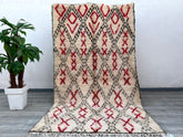 Elevate your décor with this breathtaking vintage Boujad rug, meticulously handcrafted in Morocco using age-old weaving techniques. The rich, earthy tones and tribal motifs reflect the artistry of Berber culture, making it a true collector’s item. Made from premium wool, this 5x9 ft rug offers durability and softness underfoot, perfect for high-traffic areas. Its distressed, lived-in look adds rustic charm, blending seamlessly with modern, bohemian, or traditional interiors. A versatile statement piece, it