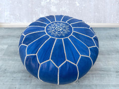 Upgrade your living space with our leather storage ottoman, combining sophistication and practicality. Made from high-quality genuine leather, this square or round ottoman features a lift-top design for hidden storage, perfect for blankets, toys, or magazines. The tufted detailing and sturdy wooden legs add a modern touch, while the soft cushioning ensures comfort as a footrest or extra seat. Ideal for small apartments, bedrooms, or entryways, this versatile leather ottoman blends seamlessly into any decor.