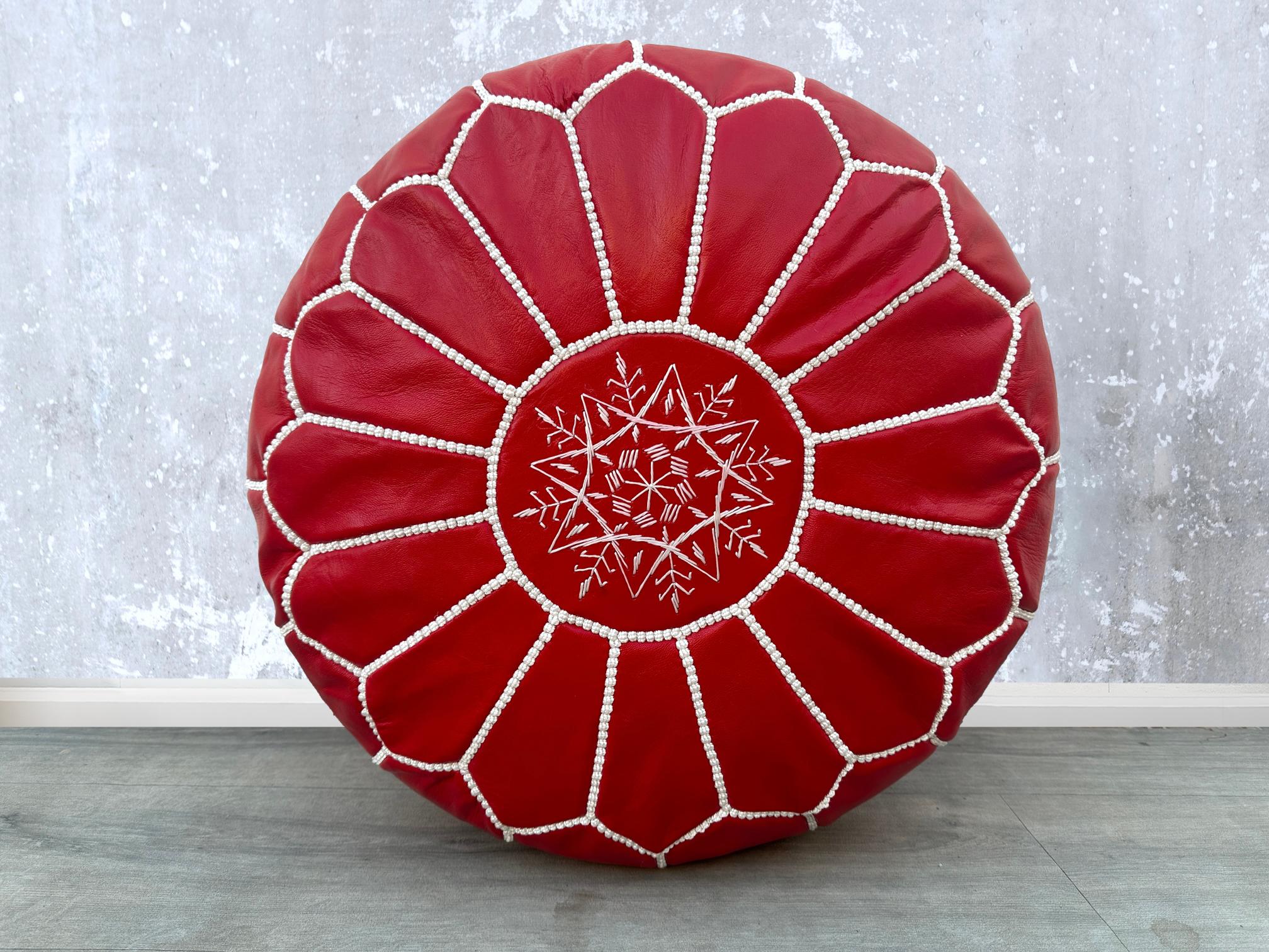 Elevate your living space with authentic Moroccan leather poufs, meticulously handcrafted by skilled artisans. Made from premium goat or buffalo leather, these bohemian ottomans feature intricate embroidery and traditional stitching. Perfect as a footstool, extra seating, or decorative accent, they add a touch of Moroccan charm to any room. Available in round, square, and oversized designs, our leather pouffes come filled or unstuffed for customization. Whether you prefer a rustic brown, deep orange, or bla