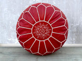 Elevate your living space with authentic Moroccan leather poufs, meticulously handcrafted by skilled artisans. Made from premium goat or buffalo leather, these bohemian ottomans feature intricate embroidery and traditional stitching. Perfect as a footstool, extra seating, or decorative accent, they add a touch of Moroccan charm to any room. Available in round, square, and oversized designs, our leather pouffes come filled or unstuffed for customization. Whether you prefer a rustic brown, deep orange, or bla