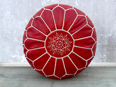 Elevate your living space with authentic Moroccan leather poufs, meticulously handcrafted by skilled artisans. Made from premium goat or buffalo leather, these bohemian ottomans feature intricate embroidery and traditional stitching. Perfect as a footstool, extra seating, or decorative accent, they add a touch of Moroccan charm to any room. Available in round, square, and oversized designs, our leather pouffes come filled or unstuffed for customization. Whether you prefer a rustic brown, deep orange, or bla