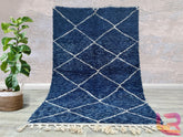 Elevate your décor with a stunning handmade blue Moroccan rug, inspired by the iconic Beni Ourain and Azilal designs. These Berber wool rugs feature soft, luxurious textures and captivating geometric patterns in shades of navy, indigo, and sky blue. Perfect for modern and bohemian interiors, each rug is crafted using traditional techniques, ensuring both beauty and durability. Whether placed in a living room, bedroom, or hallway, a blue Moroccan rug adds a touch of artisanal elegance and cozy sophistication