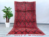 Elevate your decor with this exquisite handmade Moroccan Boujad rug, featuring bold tribal motifs and a striking red and black diamond design. Woven using centuries-old techniques, this vintage carpet embodies the essence of Berber culture with its plush texture and intricate detailing. The distressed finish enhances its antique appeal, making it a perfect fit for boho, mid-century, or global-inspired interiors. Crafted from premium wool, it offers durability and softness underfoot. Ideal as a statement flo