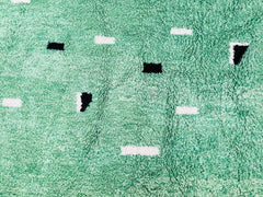 Elevate your home with a stunning handmade Moroccan green rug, crafted by skilled artisans using traditional Berber techniques. This authentic wool rug features a vibrant, earthy green hue, blending bohemian charm with timeless elegance. Each piece is handwoven with premium natural wool, ensuring durability and softness underfoot. Perfect for living rooms, bedrooms, or entryways, this Moroccan area rug adds warmth and texture to any space. The intricate geometric patterns reflect centuries of Berber heritag