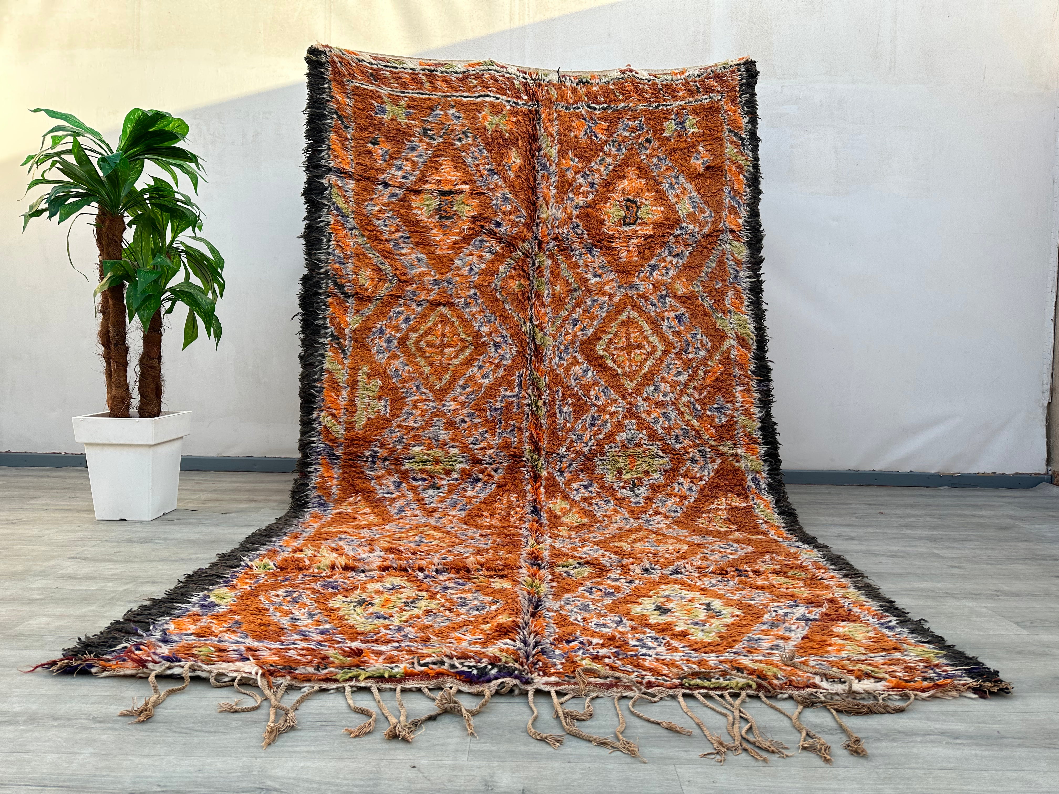 Elevate your home with handmade Moroccan runner rugs, featuring bold tribal patterns and geometric motifs. These vintage-inspired carpets are crafted using traditional weaving techniques, offering durability and artistic charm. The warm orange and red tones blend seamlessly with boho, mid-century, or contemporary interiors. Perfect for hallways, kitchens, or living spaces, these rugs add a touch of global elegance. Each piece tells a story of Berber heritage, making it a unique addition to your decor.