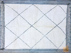 Discover the beauty of handmade Moroccan rugs, featuring Beni Ourain and Azilal styles in versatile 5x8 ft sizes. These Berber wool rugs are crafted using traditional techniques, offering a plush, shaggy texture and timeless tribal designs. Perfect for boho, modern farmhouse, or mid-century decor, each rug is unique, with natural variations that add character. The neutral black and white tones blend seamlessly with any color scheme, while the durable handwoven construction ensures long-lasting quality. Whet