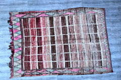 Transform your space with this large, authentic Moroccan area rug, featuring a hand-knotted tribal design. Woven by skilled artisans, this wool rug showcases intricate patterns and a luxurious texture, making it a standout piece in any room. The vintage-inspired aesthetic adds warmth and character, while the durable construction ensures long-lasting beauty. Ideal for high-traffic areas, this Berber-style rug is both stylish and practical, blending seamlessly with contemporary, bohemian, or traditional décor