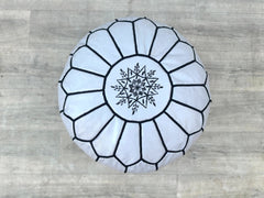 Indulge in ultimate relaxation with our extra-large leather pouffe. Hand-stitched from full-grain buffalo leather, this oversized ottoman offers plush comfort as a footrest or casual seat. The double-zippered closure keeps the filling secure, while the visible seams add rustic charm. Ideal for living rooms, home theaters, or nurseries, this durable leather pouf ages beautifully over time. Available in classic brown, black, and tan, it pairs well with mid-century, rustic, or industrial decor. Easy to clean &