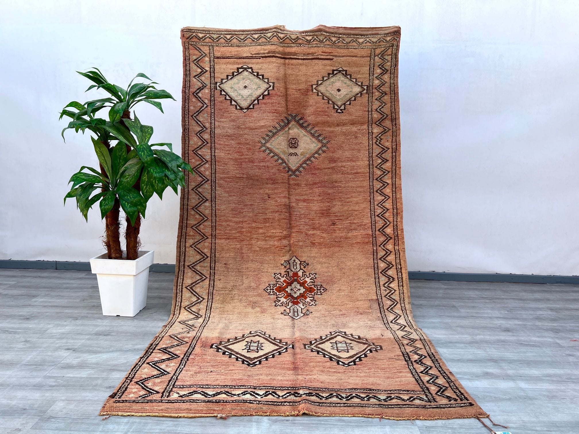 Enhance your home with this 5x10 ft vintage Berber rug, a handmade Moroccan Kilim featuring intricate tribal motifs and a soft, earthy color scheme. Woven by skilled artisans, this bohemian floor rug is made from premium wool, offering both comfort and durability. The distressed vintage finish gives it a timeless appeal, perfect for boho, farmhouse, or global-inspired interiors. Whether used as a statement area rug or a decorative wall hanging, this authentic tribal carpet adds texture and heritage to any r