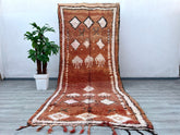 Elevate your home with this stunning 6x12 ft vintage Moroccan tribal rug, a masterpiece of Berber artistry. Hand-knotted from natural wool, this rug features intricate geometric motifs and a plush pile, offering both comfort and durability. The earthy tones and tribal patterns make it versatile for boho, farmhouse, or eclectic decor styles. Perfect as a statement area rug or a luxurious living room centerpiece, this authentic Moroccan carpet is ethically handmade using age-old techniques. Its distressed vin