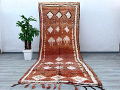 Elevate your home with this stunning 6x12 ft vintage Moroccan tribal rug, a masterpiece of Berber artistry. Hand-knotted from natural wool, this rug features intricate geometric motifs and a plush pile, offering both comfort and durability. The earthy tones and tribal patterns make it versatile for boho, farmhouse, or eclectic decor styles. Perfect as a statement area rug or a luxurious living room centerpiece, this authentic Moroccan carpet is ethically handmade using age-old techniques. Its distressed vin