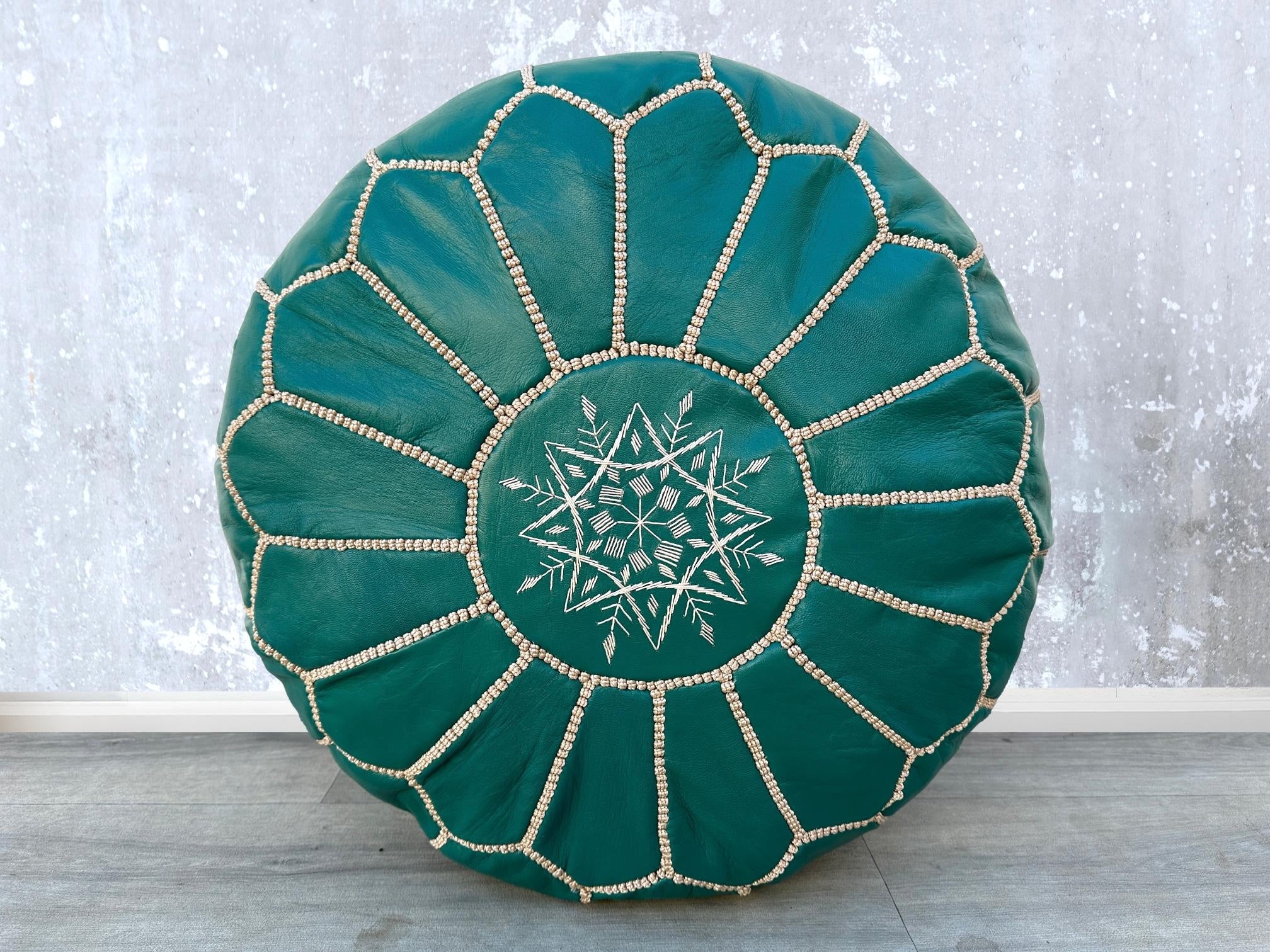 Indulge in luxurious leather footstools and pouffes, handcrafted for long-lasting comfort. Made from full-grain buffalo or goat leather, our leather ottomans are soft, supple, and resistant to wear. Ideal for propping up your feet, extra seating, or as a side table, these leather poufs enhance living rooms, home offices, and lounges. Choose from traditional Moroccan designs, modern tufted ottomans, or rustic leather benches. Many feature double-zippered closures, eco-friendly fillings, and hand-tooled detai