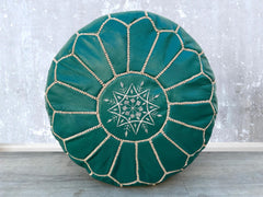 Indulge in luxurious leather footstools and pouffes, handcrafted for long-lasting comfort. Made from full-grain buffalo or goat leather, our leather ottomans are soft, supple, and resistant to wear. Ideal for propping up your feet, extra seating, or as a side table, these leather poufs enhance living rooms, home offices, and lounges. Choose from traditional Moroccan designs, modern tufted ottomans, or rustic leather benches. Many feature double-zippered closures, eco-friendly fillings, and hand-tooled detai