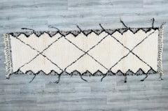 Elevate your home with a luxurious Moroccan runner rug, designed for hallways, kitchens, or living areas. These hand-knotted wool rugs (sizes like 2.9x8.5 ft and 3x10 ft) showcase Beni Ourain’s iconic diamond patterns or Azilal’s colorful tribal artistry. The ultra-soft, high-pile texture provides comfort underfoot, while the neutral or bold hues adapt to any style—modern, rustic, or bohemian. Ethically handmade using sustainable wool, these rugs are durable, hypoallergenic, and crafted to last generations.