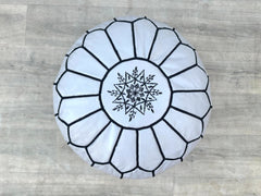 Upgrade your home with a premium leather storage ottoman, combining elegance and practicality. Designed with a lift-top lid, this square or round leather ottoman provides hidden storage for blankets, toys, or magazines. Upholstered in genuine or faux leather, it doubles as a coffee table, footrest, or extra seating. Ideal for living rooms, bedrooms, or entryways, these leather ottomans come in black, brown, and beige to match any decor. Durable stitching and sturdy construction ensure long-lasting use. Shop