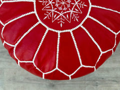 Discover handmade leather ottomans that combine function and artistry. Crafted from genuine leather, these poufs (18"–30" sizes) serve as footstools, coffee tables, or storage benches. Choose from tufted, embroidered, or minimalist designs in tan, black, or distressed finishes. Ideal for living rooms, bedrooms, or patios, our Moroccan-inspired pouffes feature double-zippered closures and recycled foam filling. Durable, easy to clean, and ethically sourced. Upgrade your home with a leather storage ottoman fr