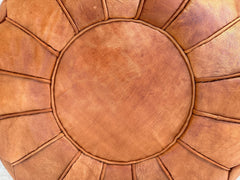 Add a contemporary flair to your space with a modern leather pouf, perfect for lounging, seating, or as a stylish accent. Crafted from soft genuine leather, these round or square ottomans feature clean lines and a minimalist design, fitting seamlessly into mid-century, boho, or Scandinavian interiors. Lightweight and portable, they can be used as a footrest in front of a sofa, a bedside stool, or a chic coffee table alternative. Available in neutral tones and bold hues, these leather pouffes are both durabl