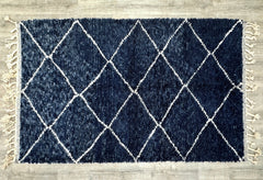 Bring comfort and style into your home with a Moroccan shag rug, featuring a soft, plush pile and relaxed boho aesthetic. These handwoven wool rugs come in deep navy, ivory, and multi-toned designs, blending seamlessly with modern, Scandinavian, or eclectic interiors. The shaggy texture provides a luxurious feel underfoot, making them ideal for bedrooms, living rooms, or reading nooks. With their durable craftsmanship and natural fibers, these rugs offer both beauty and practicality for everyday living.