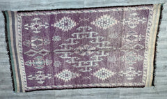Make a bold design statement with this oversized vintage Moroccan rug, featuring a striking 6x13 ft size and a luxurious wool blend. The rug’s faded Boujad-inspired patterns combine deep purples, creams, and terracotta for a warm, lived-in look. Its thick, hand-knotted pile ensures durability, while the tribal motifs add exotic flair to any space. Ideal for large living areas, dining rooms, or under-bed placement, this rug pairs beautifully with minimalist, bohemian, or rustic decor. Each piece is one-of-a-