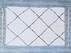 Elevate your home with this ultra-soft Moroccan wool rug, handcrafted by Berber weavers for a luxurious, organic feel. The plain, solid design in creamy white creates a calm, airy atmosphere, perfect for modern and boho interiors. Designed for both comfort and durability, this handmade rug features a thick, plush pile that feels heavenly underfoot. Ideal for living rooms, nurseries, or meditation spaces, it adds warmth without overwhelming your decor. A sustainable, ethically made piece, this authentic Moro