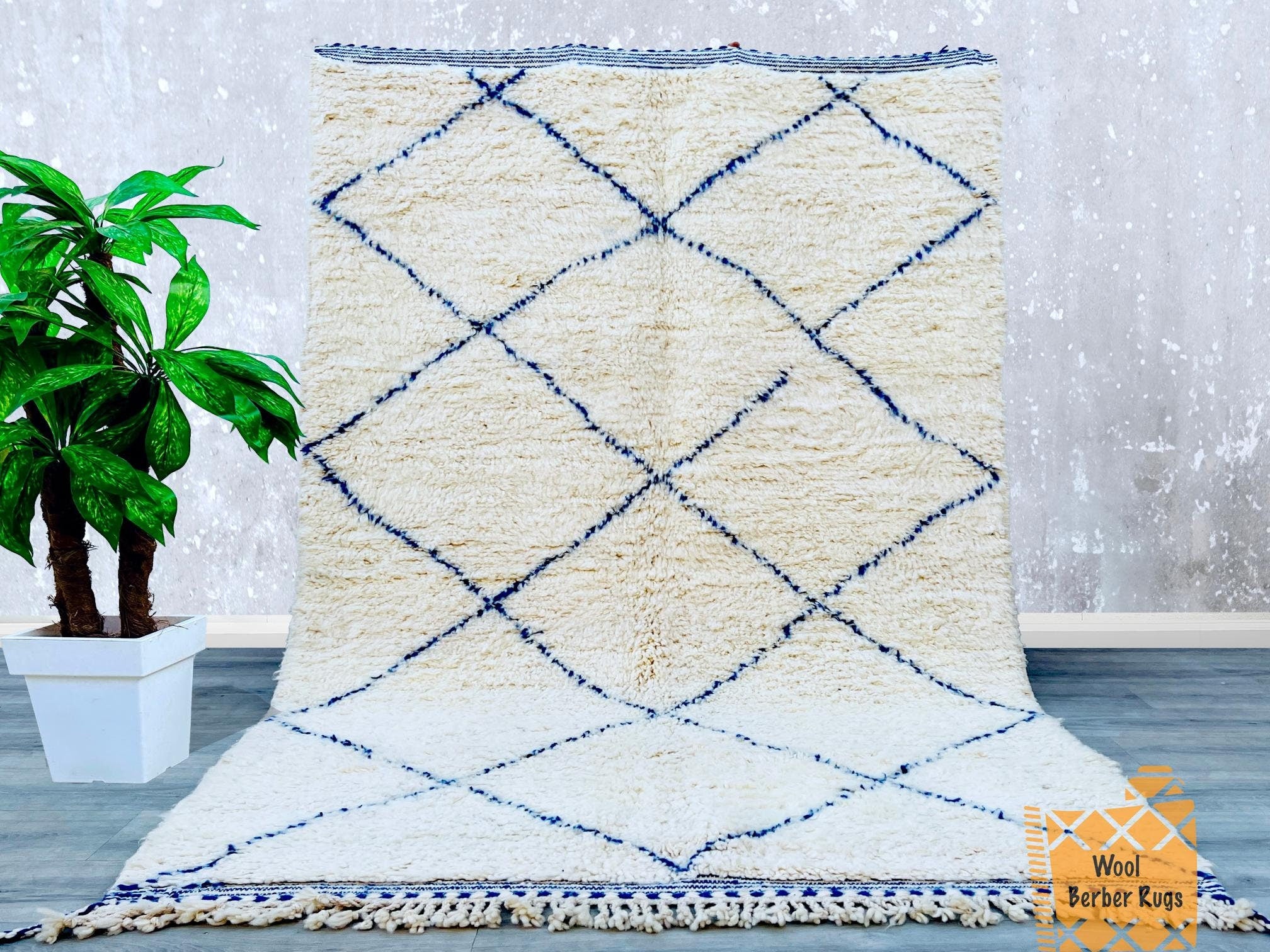 Bring a touch of Moroccan heritage into your home with this handwoven Berber rug, featuring a classic checkered pattern in blue and ivory. Made from premium sheep’s wool, this plush, high-pile rug offers unmatched softness and durability. The intricate geometric motifs reflect traditional craftsmanship, making it a versatile statement piece for contemporary or bohemian décor. Whether used as a floor runner, area rug, or wall hanging, this authentic Moroccan carpet enhances any room with texture, warmth, and