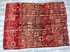 Discover the charm of a tribal Boujad rug, a vintage Moroccan wool carpet featuring bold patterns and rich, faded hues. This handmade Berber rug is crafted using traditional techniques, ensuring durability and a unique distressed look. The intricate geometric motifs and warm color palette make it a perfect fit for eclectic, bohemian, or farmhouse-style spaces. Whether layered over hardwood floors or used as a standalone statement piece, this vintage area rug brings authenticity and global flair to your home