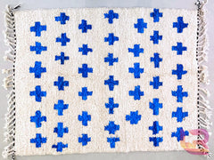 Elevate your home with a handmade blue and white Moroccan rug, crafted from natural wool for a soft, pet-friendly finish. These Beni Ourain and checkered designs are available in large sizes (8x10 ft, 7x10 ft) and feature tribal patterns, geometric crosses, or checkerboard motifs. Perfect for boho, modern, or farmhouse decor, each rug is fair trade and supports Moroccan artisans. Browse Etsy, Pinterest, or Shopify for customizable options, including abstract, Azilal, or vintage-inspired styles. Durable, sty