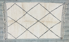 Bring bohemian sophistication into your space with a vintage-inspired Beni Ourain-style rug. Known for its soft, shaggy pile and neutral cream tones, this rug features subtle black geometric motifs for a refined yet cozy look. Perfect for Scandinavian, hygge, or eclectic interiors, it adds organic texture and warmth underfoot. Handmade using traditional weaving techniques, this rug is both durable and stylish, ideal for layering in living rooms, nurseries, or reading nooks. A must-have for those who love ar