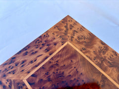 Store your cherished jewelry in this exquisite vintage-style wooden jewelry box, designed for both beauty and functionality. The handcrafted burl wood construction showcases unique natural patterns, while the sturdy lock and key ensure your valuables remain secure. Inside, the two-tiered storage system keeps necklaces, bracelets, and rings neatly organized. The hinged lid and smooth finish enhance its classic appeal, making it an ideal decorative piece for any bedroom or dressing table. Whether as a romanti